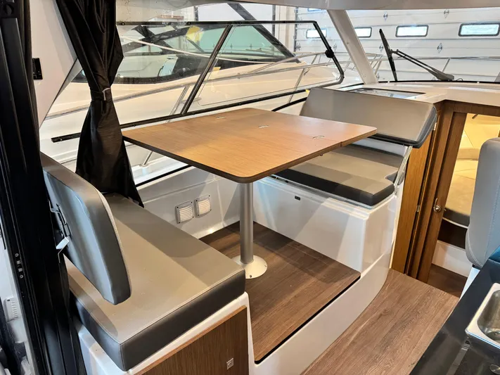  Yacht Photos Pics Interior of 2022 Beneteau Antares 9 with dining area and seating.
