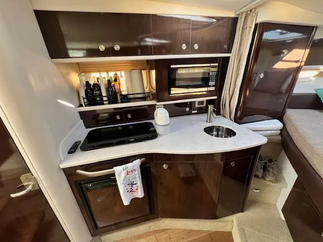  Yacht Photos Pics 2017 Sea Ray 330 Sundancer yacht interior kitchen with modern appliances and sleek cabinetry.