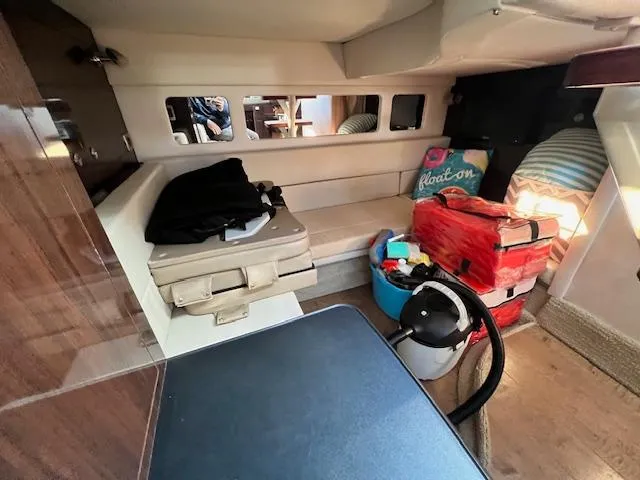  Yacht Photos Pics 2017 Sea Ray 330 Sundancer cabin interior with seating, luggage, and nautical decor.