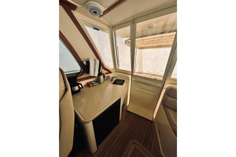 Grand Finale Yacht Photos Pics 2008 Sabre 38 Hard Top Express interior with seating and counter space.