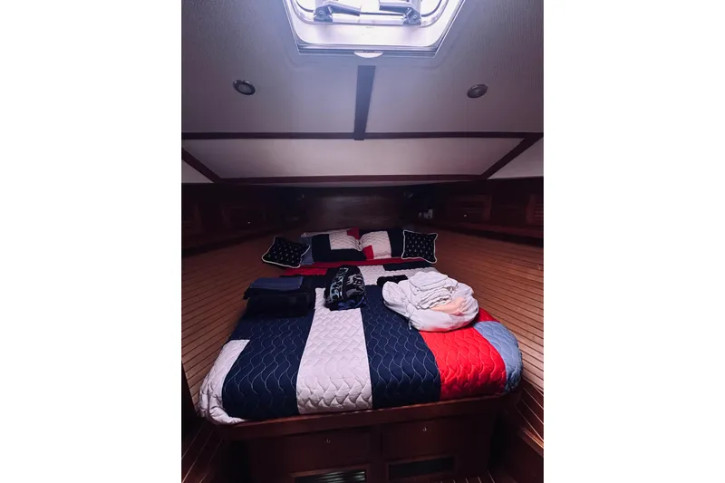 Grand Finale Yacht Photos Pics Cozy cabin interior of 2008 Sabre 38 Hard Top Express with colorful bedding.