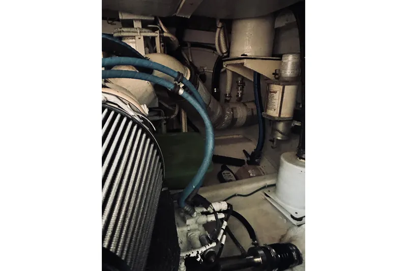 Grand Finale Yacht Photos Pics Engine room of 2008 Sabre 38 Hard Top Express with visible hoses and components.