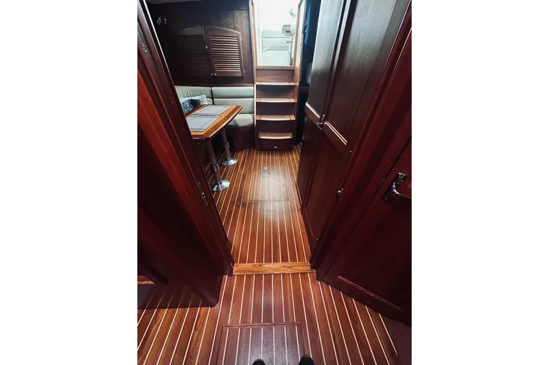 Grand Finale Yacht Photos Pics 2008 Sabre 38 Hard Top Express interior with wooden flooring and seating area.