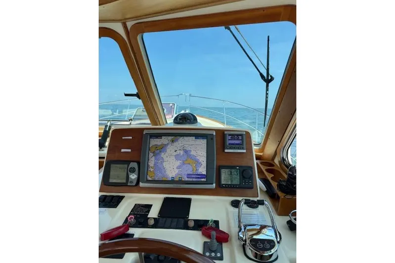 Grand Finale Yacht Photos Pics 2008 Sabre 38 Hard Top Express helm with navigation equipment and sea view.