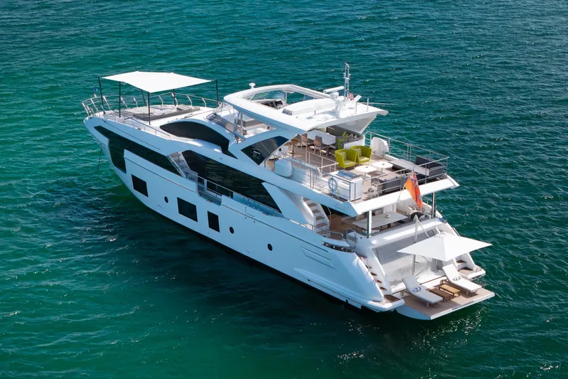 No Name Yacht Photos Pics Luxury Azimut Grande 27 METRI yacht, 2022 model, cruising on clear blue waters.