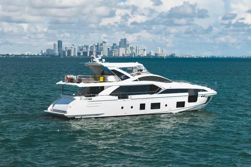No Name Yacht Photos Pics Luxury Azimut Grande 27 METRI yacht cruising near city skyline, 2022 model.