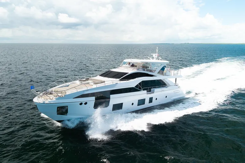 No Name Yacht Photos Pics Luxury yacht Azimut Grande 27 METRI 2022 cruising on open sea under clear skies.