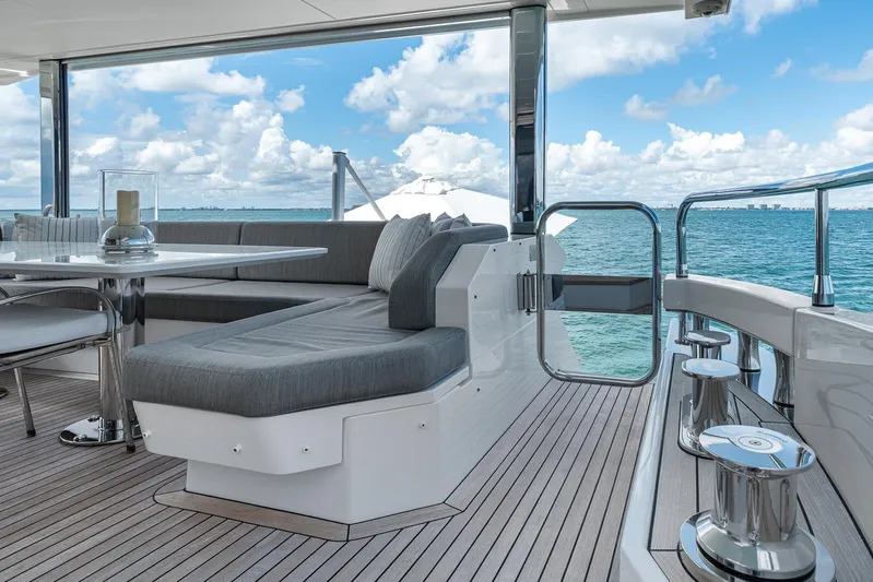 No Name Yacht Photos Pics Luxurious Azimut Grande 27 METRI yacht deck with elegant seating, ocean view, and modern design.