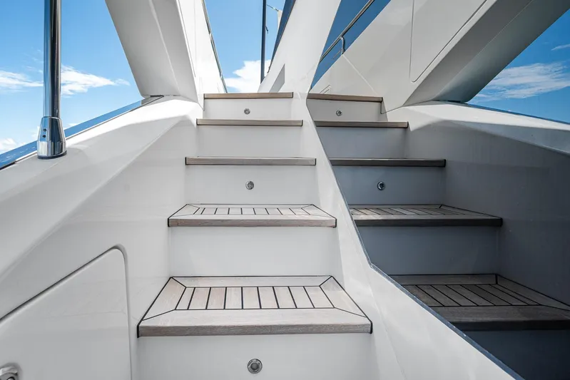No Name Yacht Photos Pics Staircase on 2022 Azimut Grande 27 METRI yacht under clear blue sky.