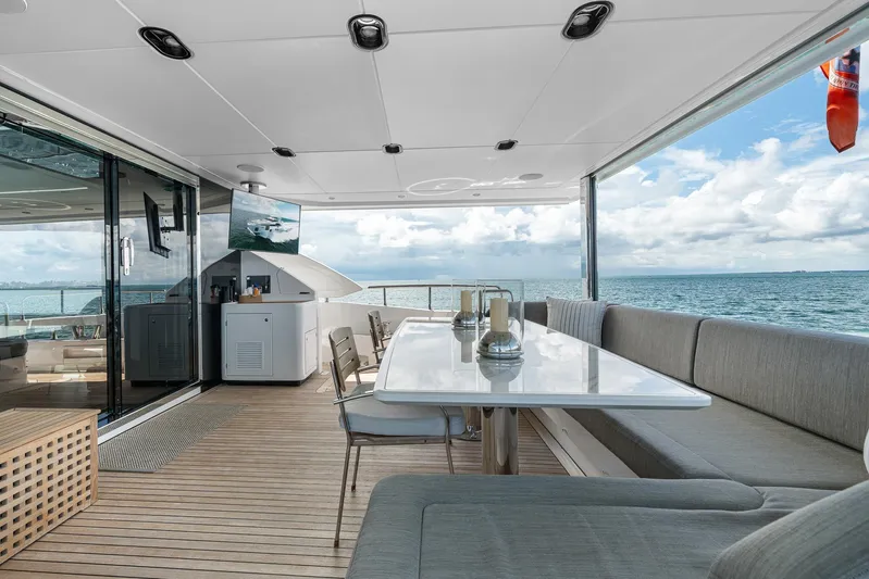 No Name Yacht Photos Pics Luxurious 2022 Azimut Grande 27 METRI yacht deck with elegant seating and ocean view.