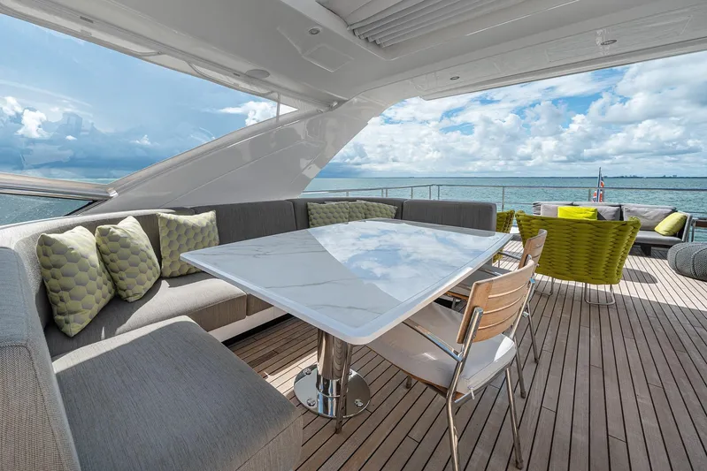 No Name Yacht Photos Pics Luxurious deck of 2022 Azimut Grande 27 METRI yacht with elegant seating and ocean view.