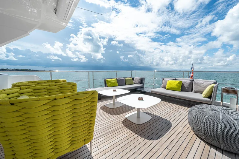 No Name Yacht Photos Pics Luxurious deck of 2022 Azimut Grande 27 METRI yacht with modern seating and ocean view.