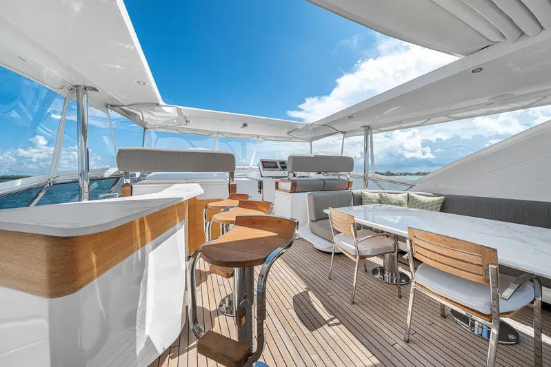 No Name Yacht Photos Pics Luxurious 2022 Azimut Grande 27 METRI yacht deck with elegant seating and ocean view.
