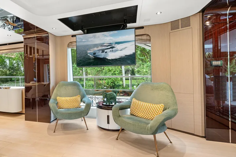 No Name Yacht Photos Pics Luxurious Azimut Grande 27 METRI 2022 yacht interior with modern seating and large TV display.