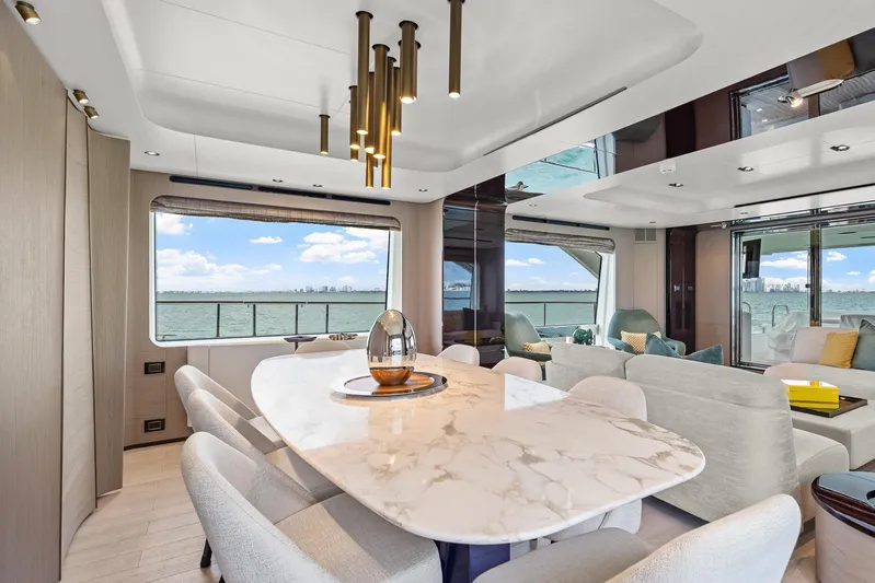 No Name Yacht Photos Pics Luxurious interior of 2022 Azimut Grande 27 METRI yacht with elegant dining area and sea view.