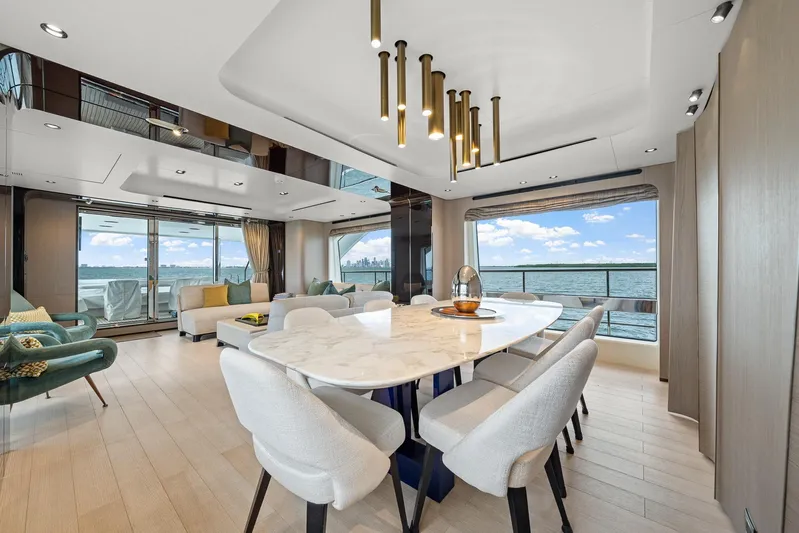 No Name Yacht Photos Pics Luxurious interior of 2022 Azimut Grande 27 METRI yacht with elegant dining area and sea view.