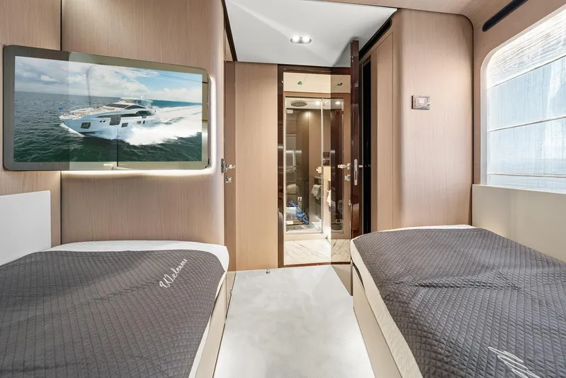 No Name Yacht Photos Pics Luxurious interior of 2022 Azimut Grande 27 METRI yacht with twin beds and modern decor.