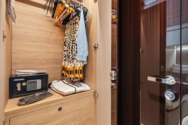 No Name Yacht Photos Pics Luxurious yacht closet with safe and hanging clothes, Azimut Grande 27 METRI 2022 model.