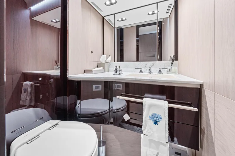 No Name Yacht Photos Pics Luxurious bathroom in 2022 Azimut Grande 27 METRI yacht, featuring elegant fixtures and modern design.