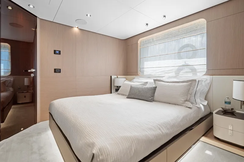 No Name Yacht Photos Pics Luxurious bedroom interior of 2022 Azimut Grande 27 METRI yacht, featuring elegant design and modern amenities.
