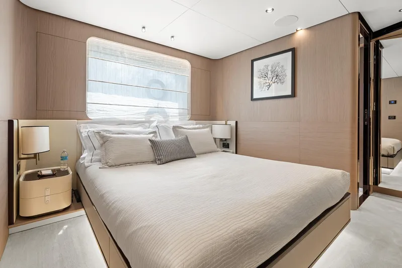 No Name Yacht Photos Pics Luxurious bedroom interior of 2022 Azimut Grande 27 METRI yacht, featuring elegant design and modern amenities.