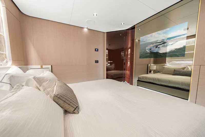 No Name Yacht Photos Pics Luxurious bedroom interior of 2022 Azimut Grande 27 METRI yacht, featuring elegant design and comfort.