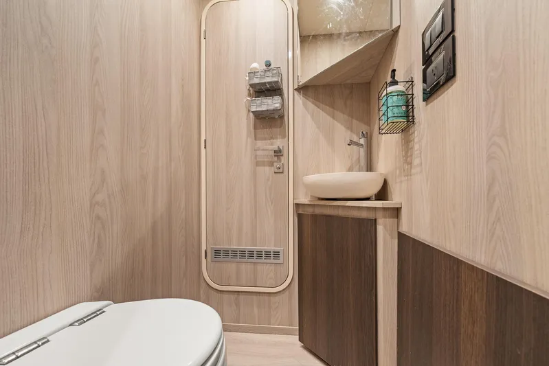 No Name Yacht Photos Pics Luxurious bathroom interior of 2022 Azimut Grande 27 METRI yacht, featuring modern fixtures.