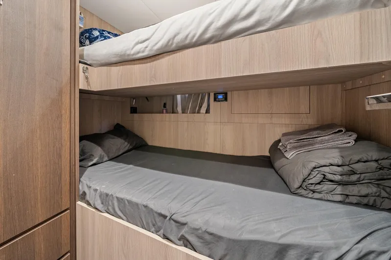 No Name Yacht Photos Pics Bunk beds in 2022 Azimut Grande 27 METRI yacht cabin with wood paneling.