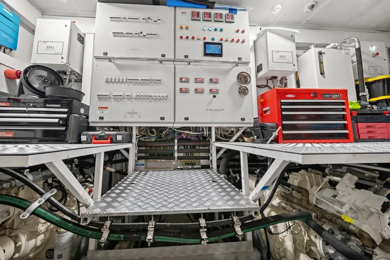 No Name Yacht Photos Pics Engine room of 2022 Azimut Grande 27 METRI yacht with control panels and toolboxes.
