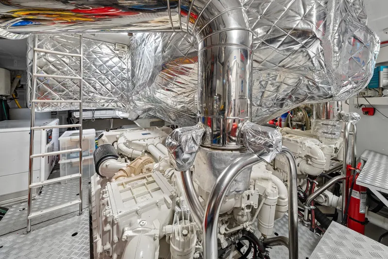 No Name Yacht Photos Pics Engine room of 2022 Azimut Grande 27 METRI yacht, featuring advanced machinery and metallic finishes.