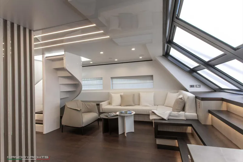  Yacht Photos Pics Luxurious interior of 2025 MandaYachts 8 SPIDER with modern seating and spiral staircase.