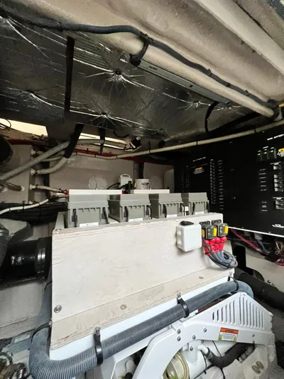 St. Anna Yacht Photos Pics Engine room of 2016 Sea Ray L650 Fly yacht, showcasing mechanical components and wiring.