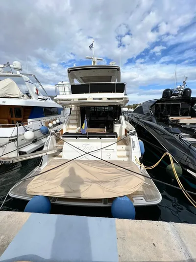 St. Anna Yacht Photos Pics 2016 Sea Ray L650 Fly yacht docked at marina, surrounded by other boats.