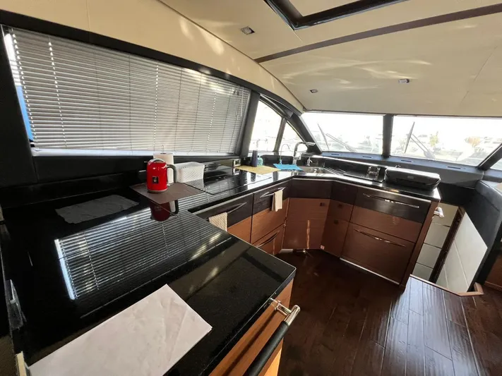 St. Anna Yacht Photos Pics Luxurious kitchen interior of 2016 Sea Ray L650 Fly yacht with modern amenities.