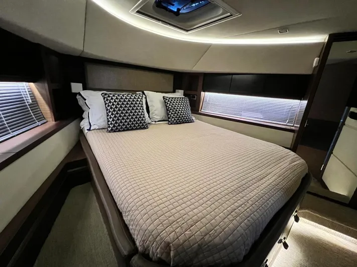 St. Anna Yacht Photos Pics Luxurious bedroom interior of 2016 Sea Ray L650 Fly yacht with modern design and cozy bedding.