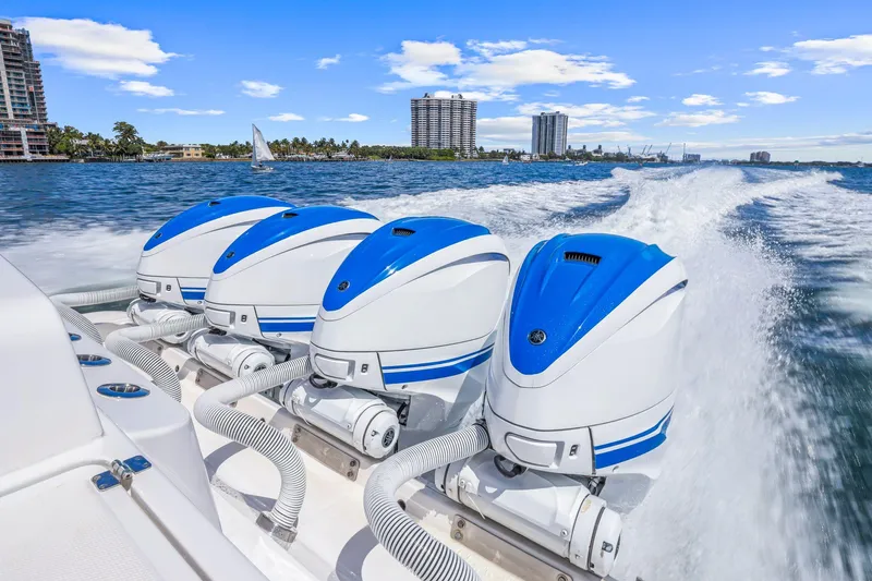 Polar II Yacht Photos Pics Powerful 2020 HCB 53 boat with triple outboard engines cruising on a sunny day.