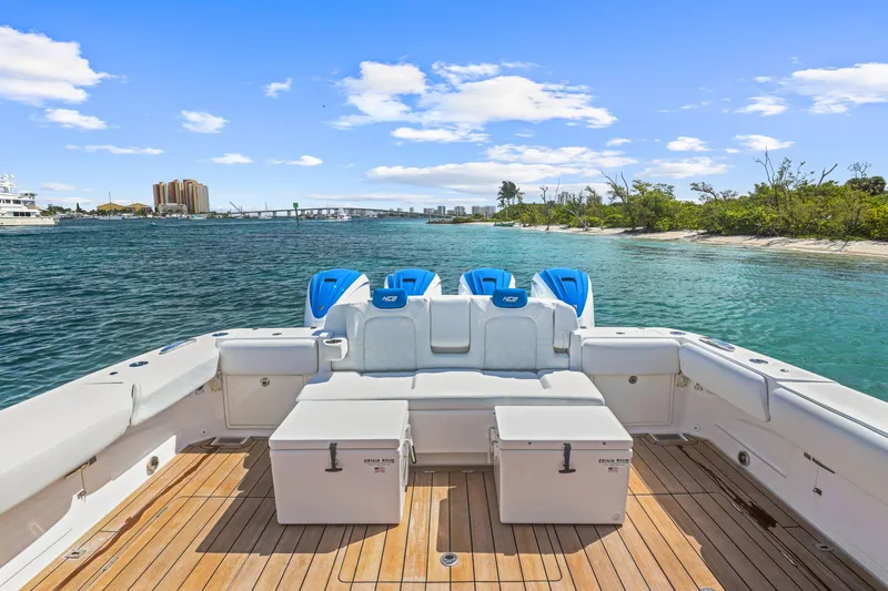 Polar II Yacht Photos Pics 2020 HCB 53 boat with spacious deck, scenic waterway, and clear blue sky.