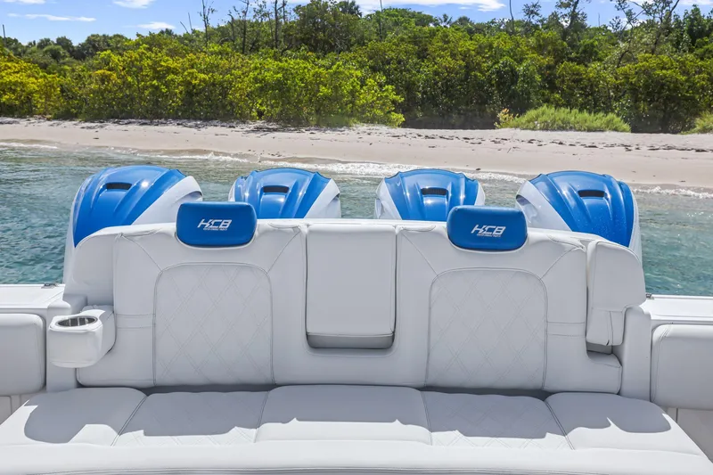 Polar II Yacht Photos Pics Luxury HCB 53 boat with blue engines, white seating, near a sandy beach, 2020 model.