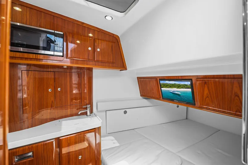 Polar II Yacht Photos Pics Luxurious cabin interior of 2020 HCB 53 yacht with wood finish and modern amenities.