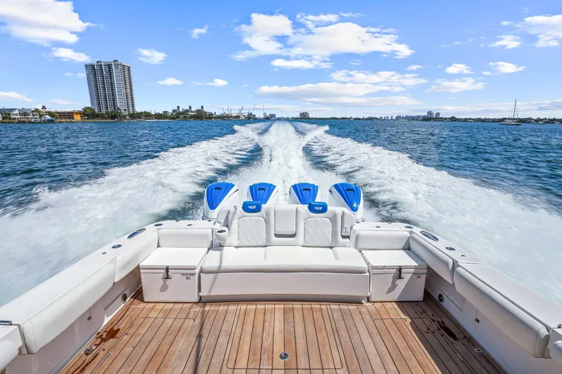 Polar II Yacht Photos Pics 2020 HCB 53 boat cruising on open water with city skyline in background.