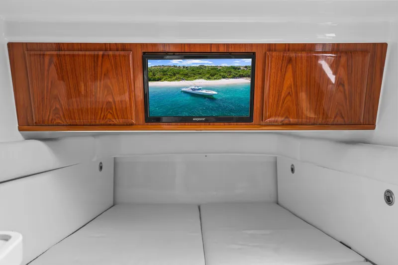 Polar II Yacht Photos Pics Interior of 2020 HCB 53 yacht with wood paneling and a mounted TV screen.