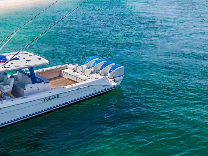 Polar II Yacht Photos Pics Luxury HCB 53 boat from 2020 on clear blue water near sandy beach.