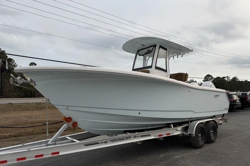  Yacht Photos Pics 2026 Sea Hunt Gamefish 25 boat on trailer, side view, outdoors.