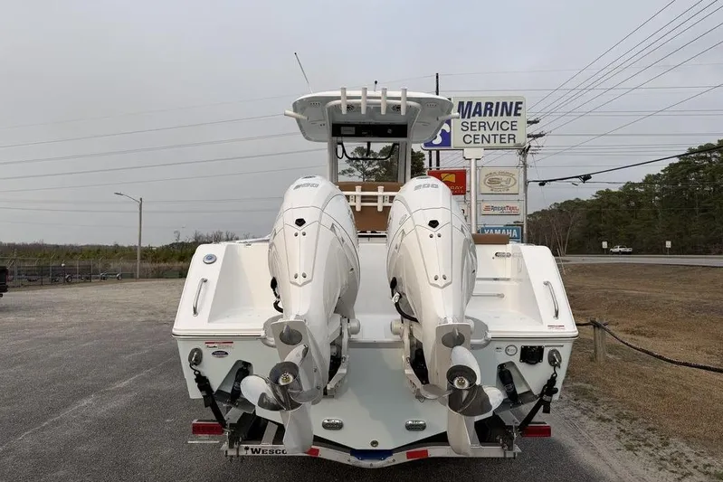  Yacht Photos Pics 2026 Sea Hunt Gamefish 25 with dual outboard engines at marine service center.