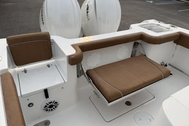  Yacht Photos Pics 2026 Sea Hunt Gamefish 25 boat interior with brown seating and Yamaha engines.