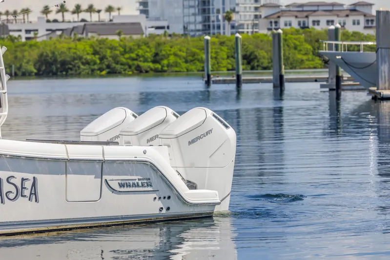  Yacht Photos Pics 2023 Boston Whaler 405 Conquest with Mercury engines docked in a marina.