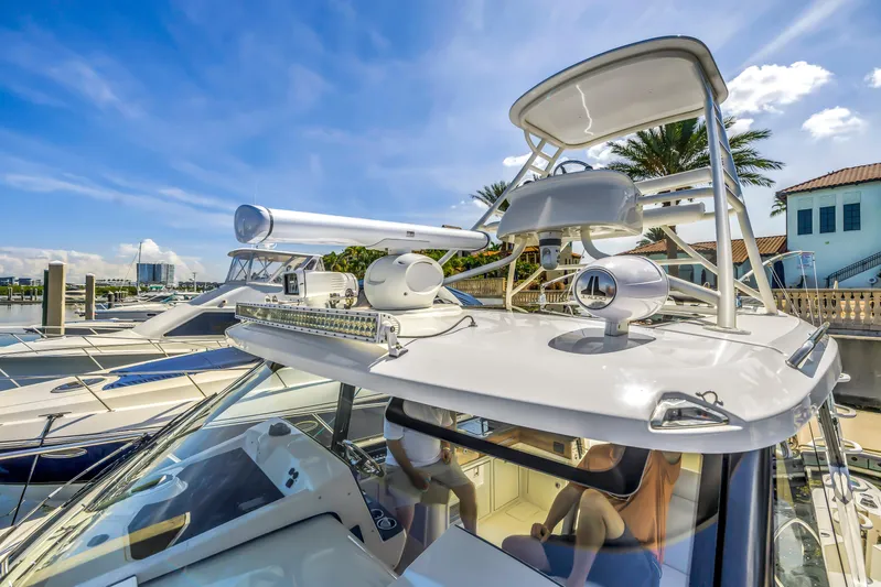  Yacht Photos Pics 2023 Boston Whaler 405 Conquest yacht docked under a clear blue sky.