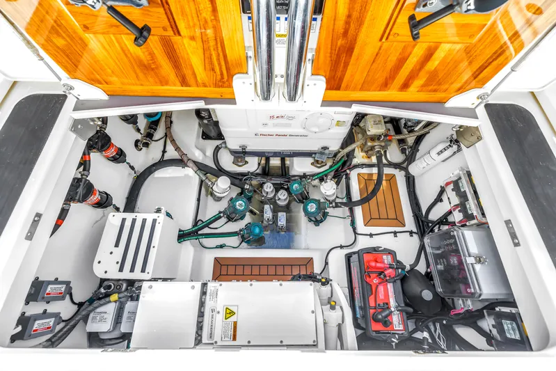  Yacht Photos Pics Engine room of 2023 Boston Whaler 405 Conquest, showcasing organized mechanical components and systems.