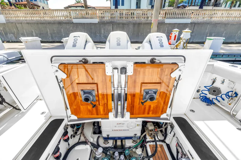  Yacht Photos Pics 2023 Boston Whaler 405 Conquest boat engine compartment with open hatch and visible equipment.