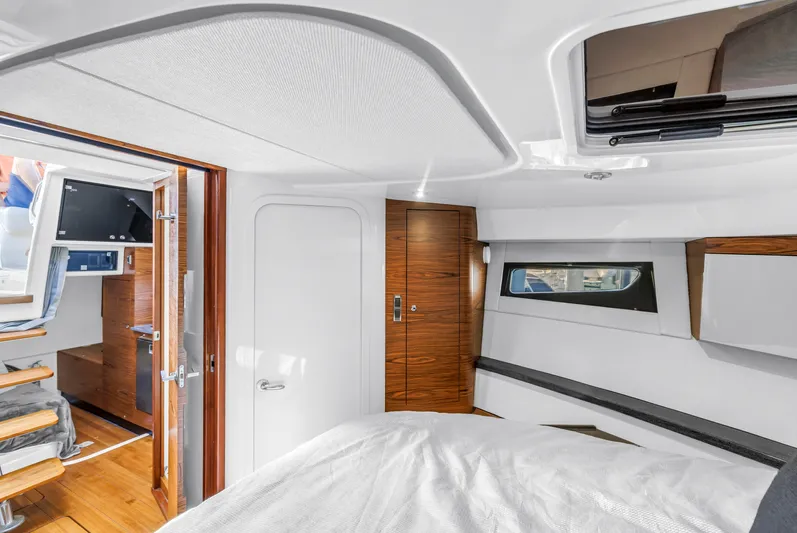  Yacht Photos Pics Interior of 2023 Boston Whaler 405 Conquest, featuring modern wood finishes and cozy cabin space.